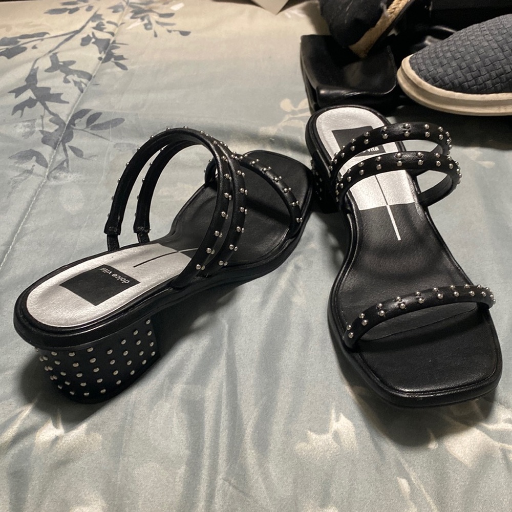 Black 2” with silver studs on straps and heel. Wore once, too big for me.